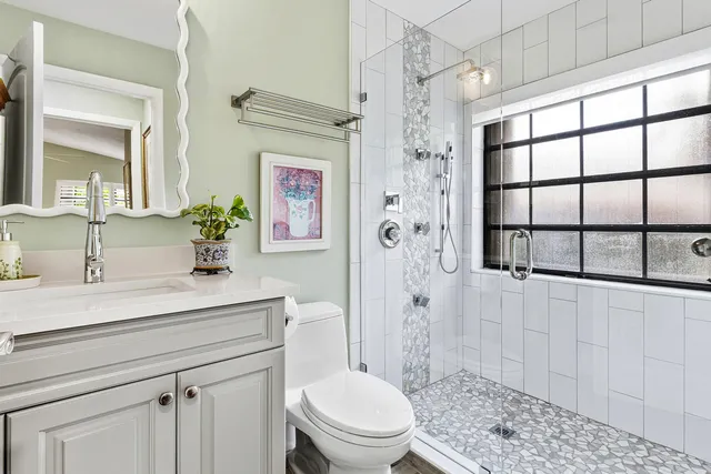 a living room with furniture a rug and a flat screen tv