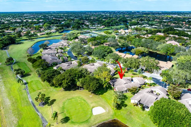 an aerial view of a house with a yard swimming pool outdoor seating and yard