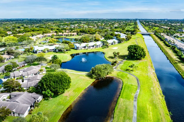 a view of swimming pool with outdoor seating and city view