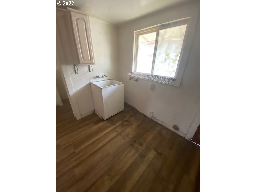 1059 A Street Springfield, OR 97477 - Photo 8 of 10 a view of a room that has a window and a table in it