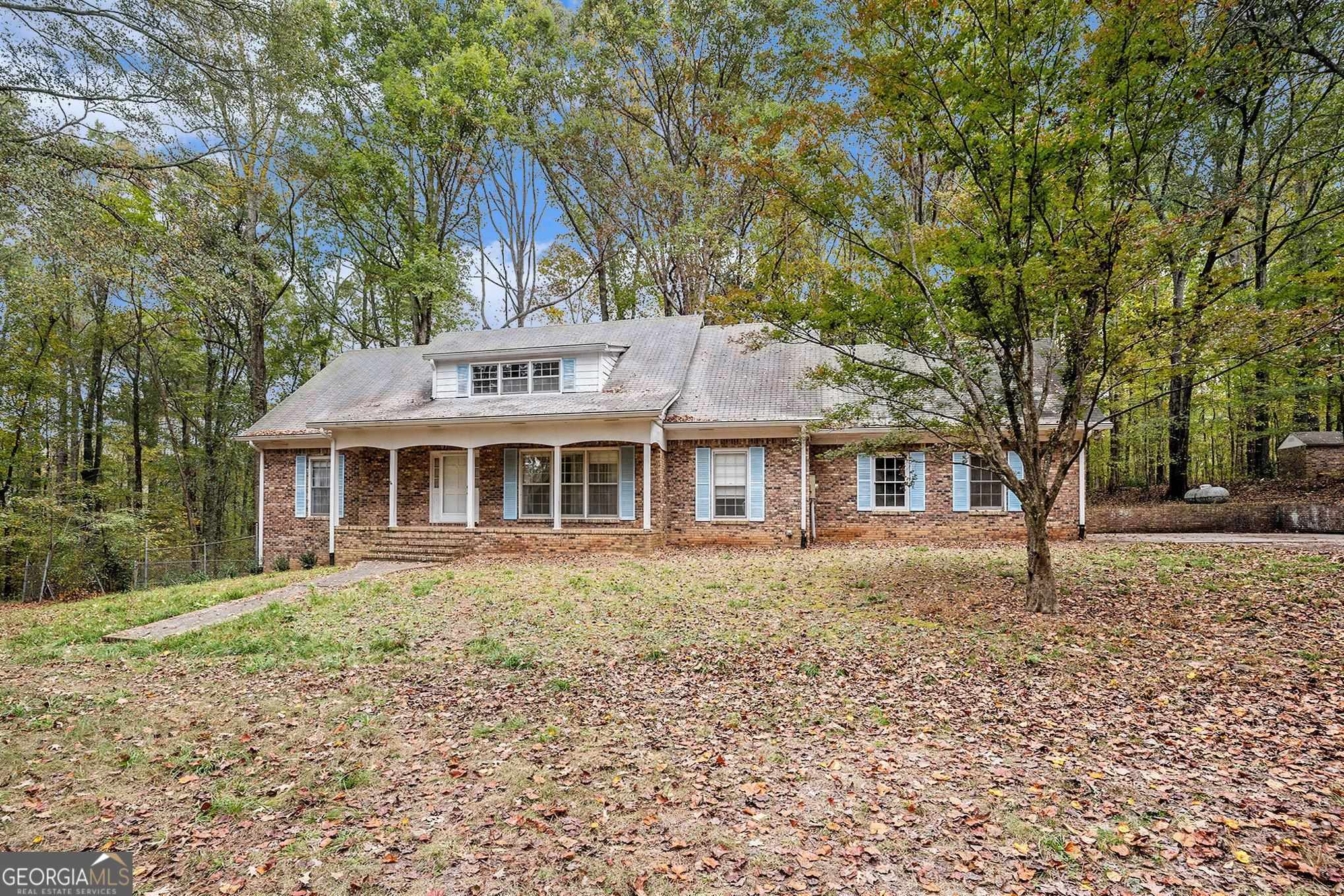 518 Moore Road Griffin, GA 30223 - Photo 1 of 1 a front view of a house with a garden