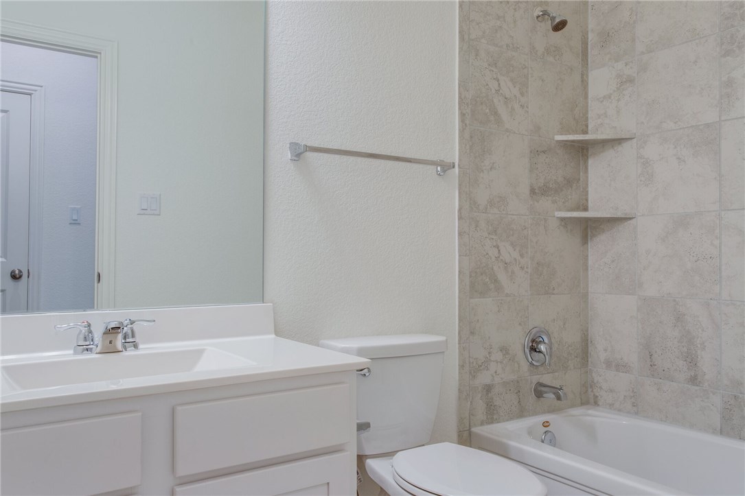312 Prato Place Georgetown, TX 78628 - Photo 12 of 33 a bathroom with a sink a toilet and shower