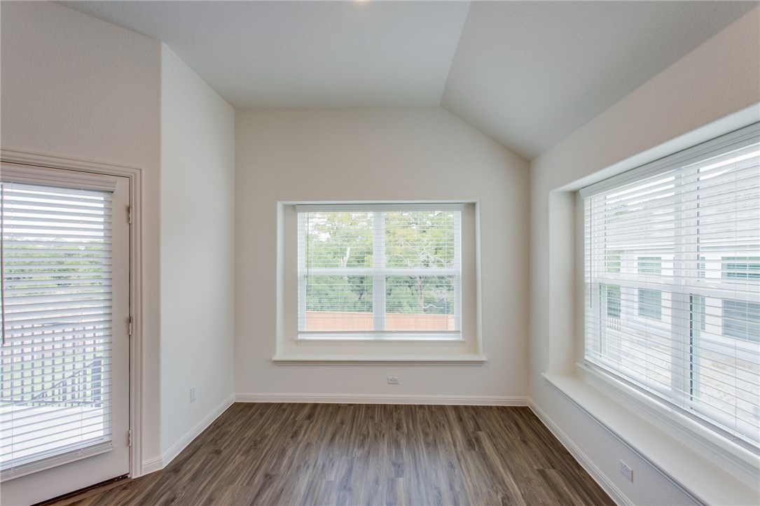 312 Prato Place Georgetown, TX 78628 - Photo 25 of 33 a view of an empty room with glass window and hardwood floor