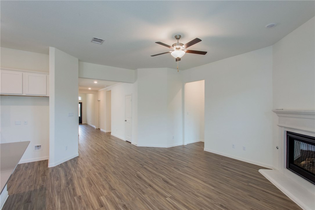 312 Prato Place Georgetown, TX 78628 - Photo 29 of 33 a view of empty room with wooden floor