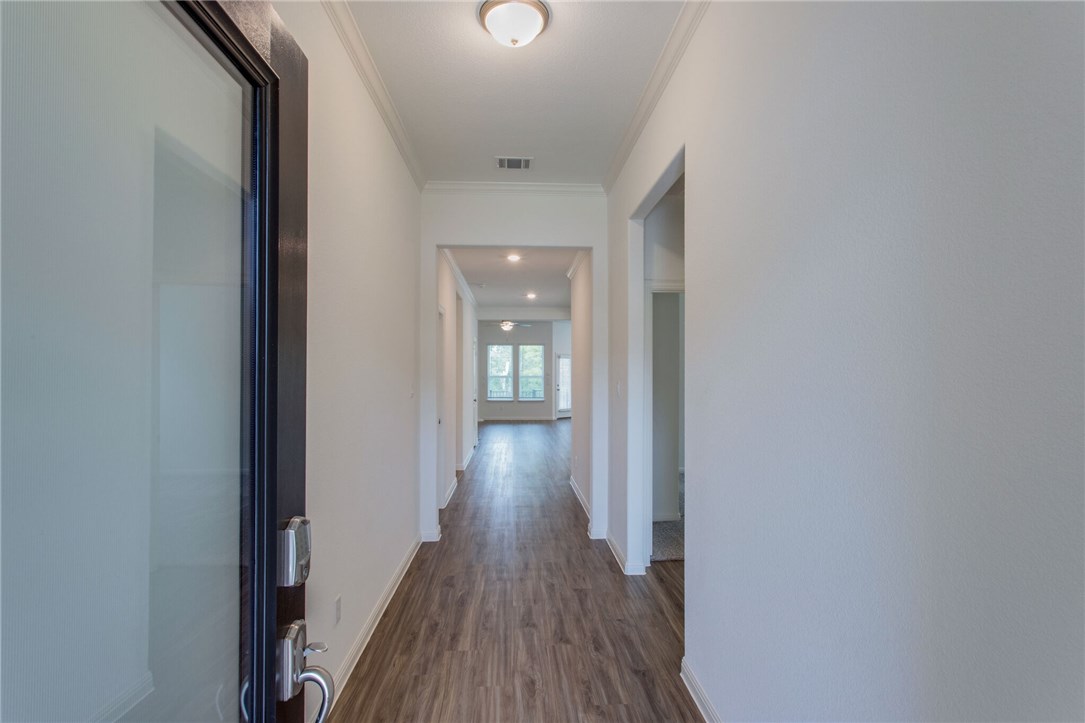 312 Prato Place Georgetown, TX 78628 - Photo 33 of 33 a view of a hallway with wooden floor