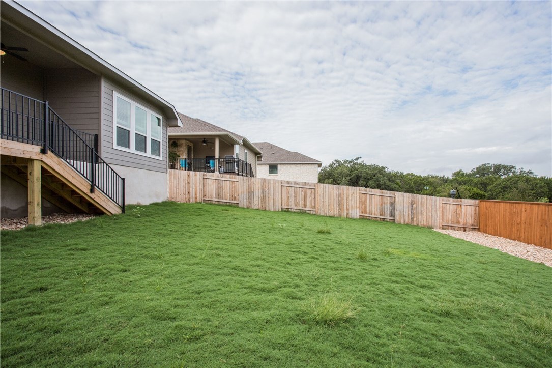 312 Prato Place Georgetown, TX 78628 - Photo 4 of 33 a view of a backyard with a garden