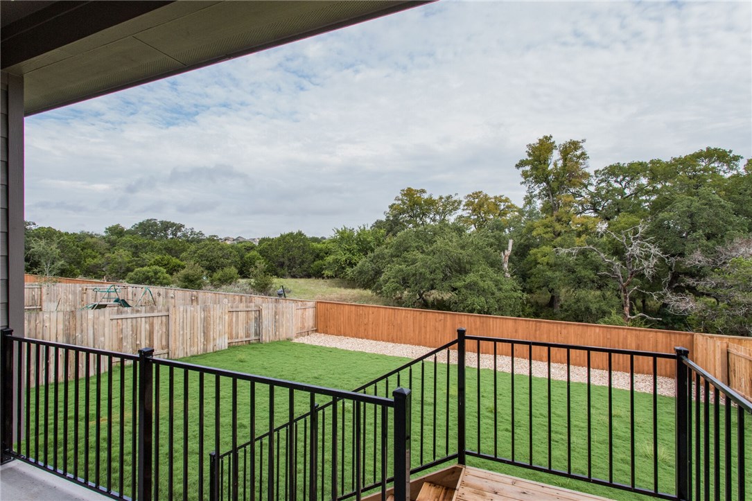 312 Prato Place Georgetown, TX 78628 - Photo 9 of 33 a balcony with trees in the background