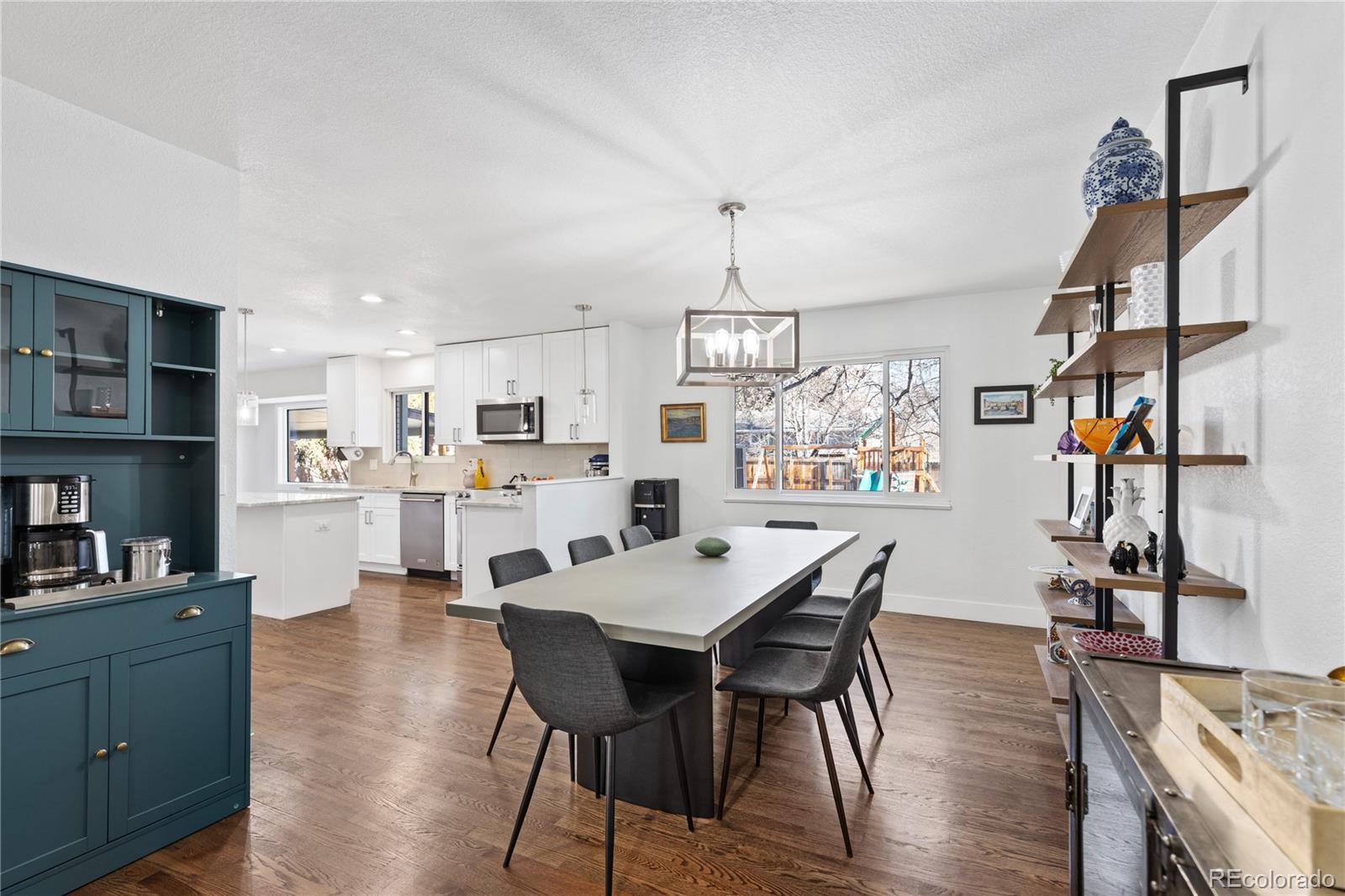 3764 South Niagara Way Denver, CO 80237 - Photo 12 of 50 a view of a dining room with furniture and wooden floor