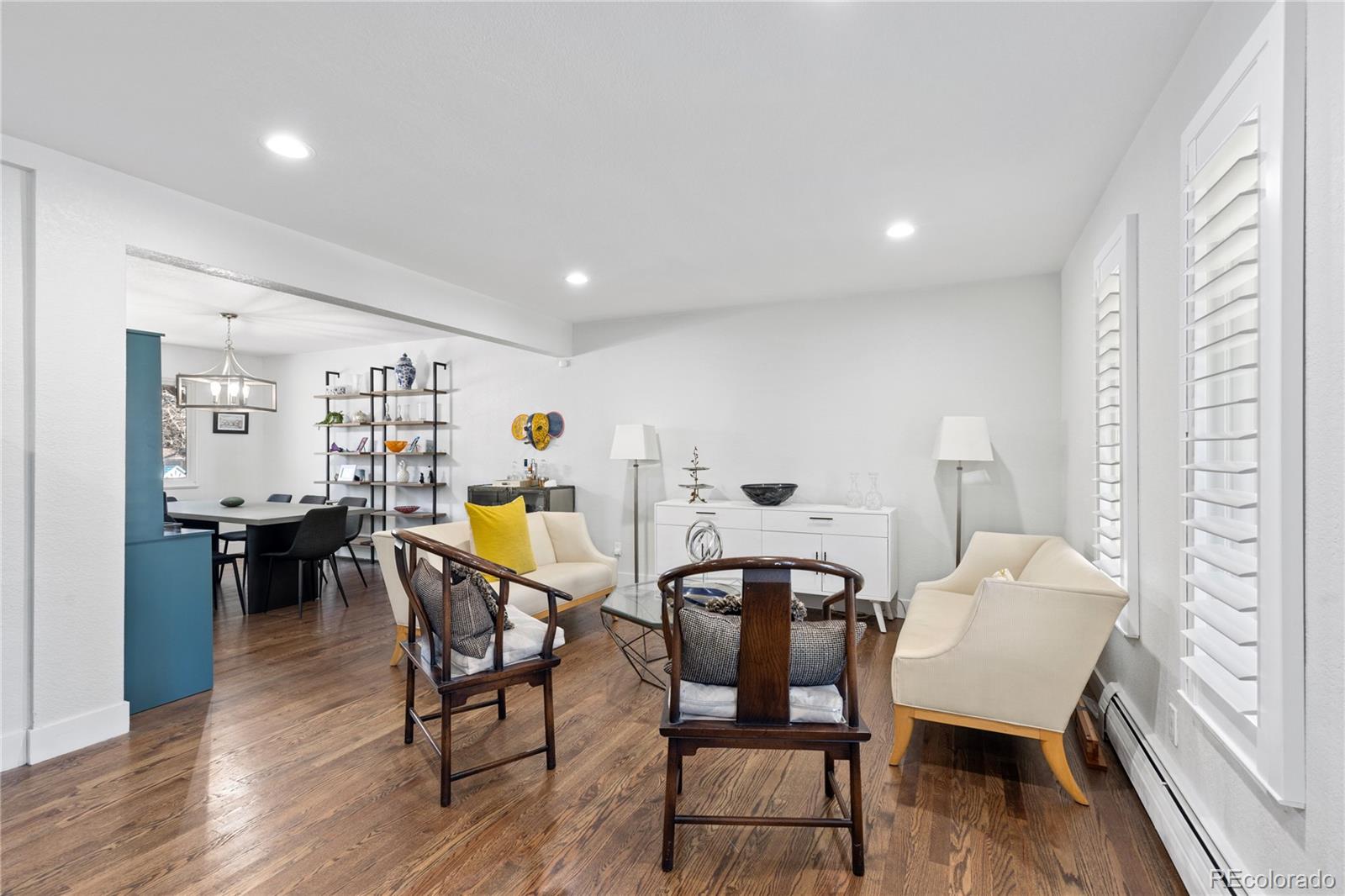 3764 South Niagara Way Denver, CO 80237 - Photo 13 of 50 a view of a dining room with furniture and wooden floor