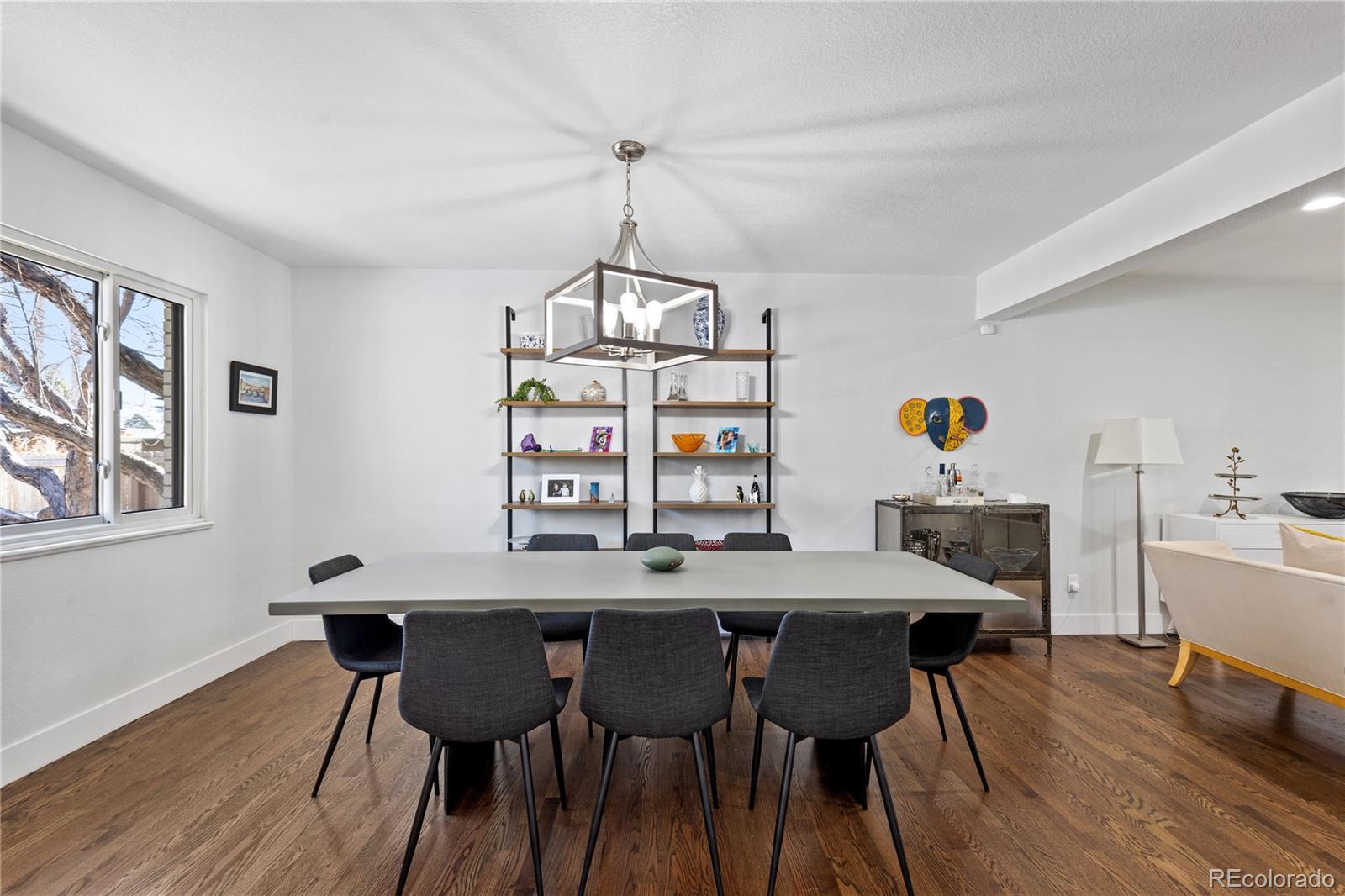 3764 South Niagara Way Denver, CO 80237 - Photo 19 of 50 a view of a dining room with a table and chairs