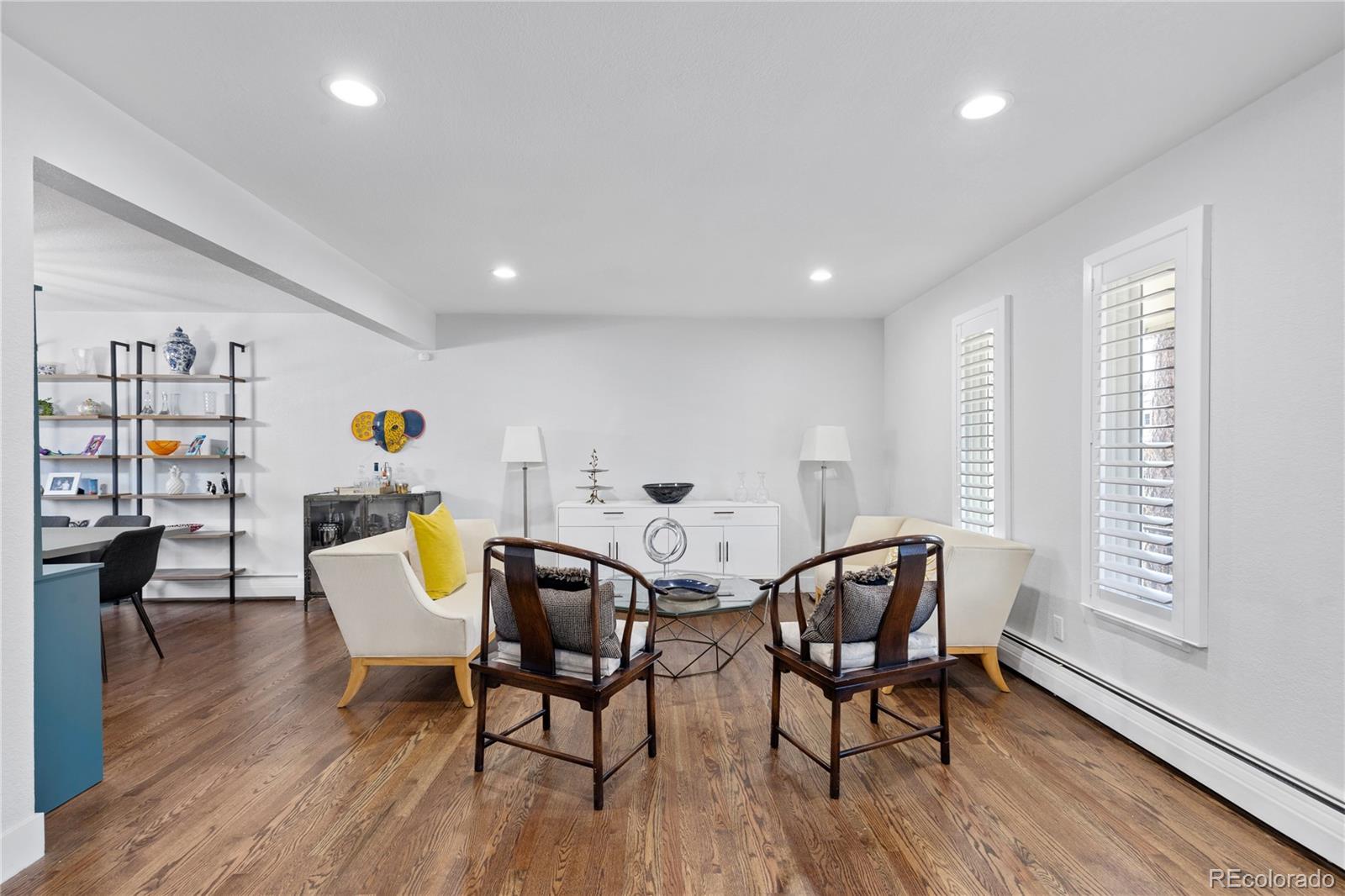 3764 South Niagara Way Denver, CO 80237 - Photo 20 of 50 a view of a dining room with furniture and wooden floor