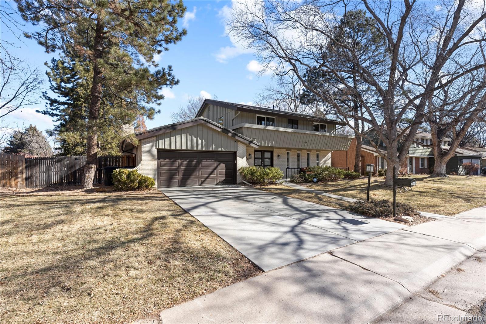 3764 South Niagara Way Denver, CO 80237 - Photo 2 of 50 a view of a house with snow on the road