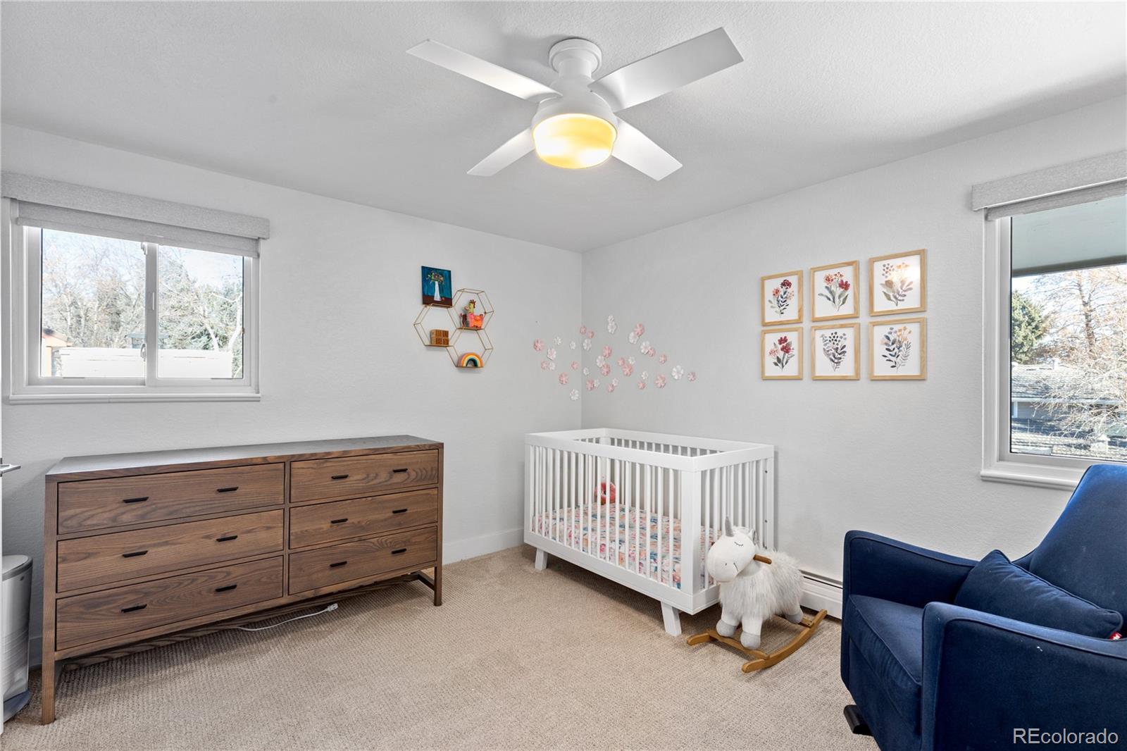 3764 South Niagara Way Denver, CO 80237 - Photo 34 of 50 a bedroom with furniture and a window