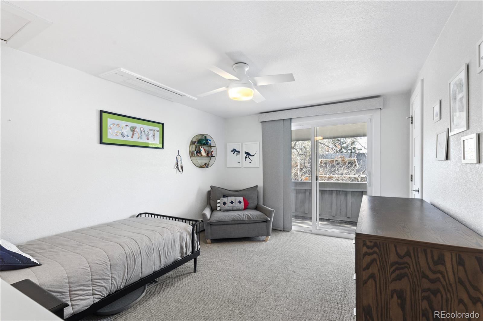 3764 South Niagara Way Denver, CO 80237 - Photo 37 of 50 a bedroom with a bed and a large window