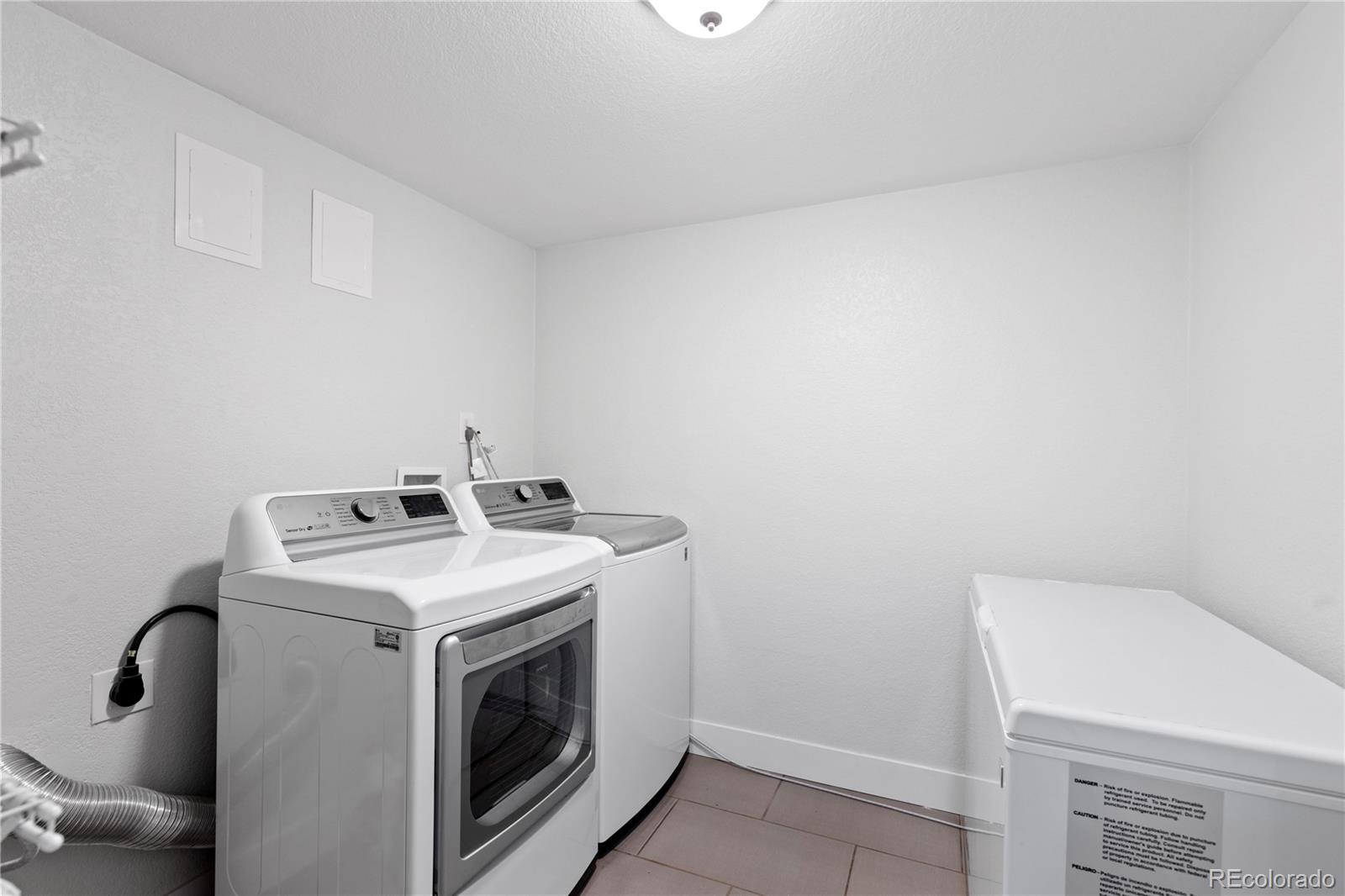 3764 South Niagara Way Denver, CO 80237 - Photo 42 of 50 a utility room with dryer and washer