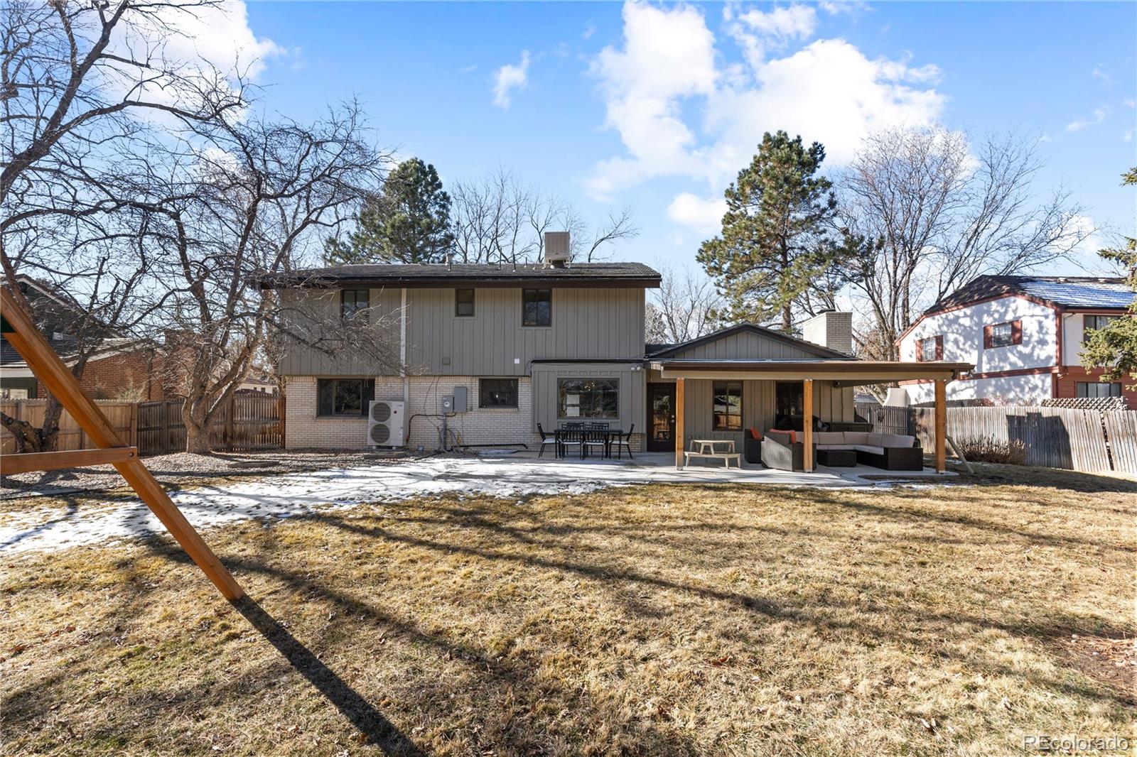 3764 South Niagara Way Denver, CO 80237 - Photo 43 of 50 a big house with trees in front of it