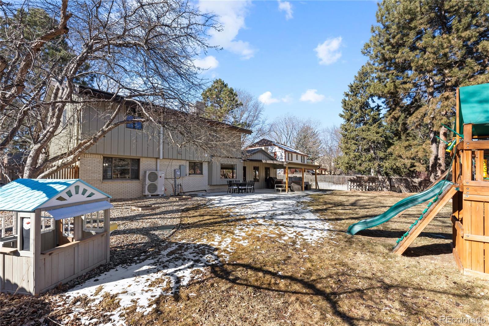 3764 South Niagara Way Denver, CO 80237 - Photo 46 of 50 a front view of a house with a yard