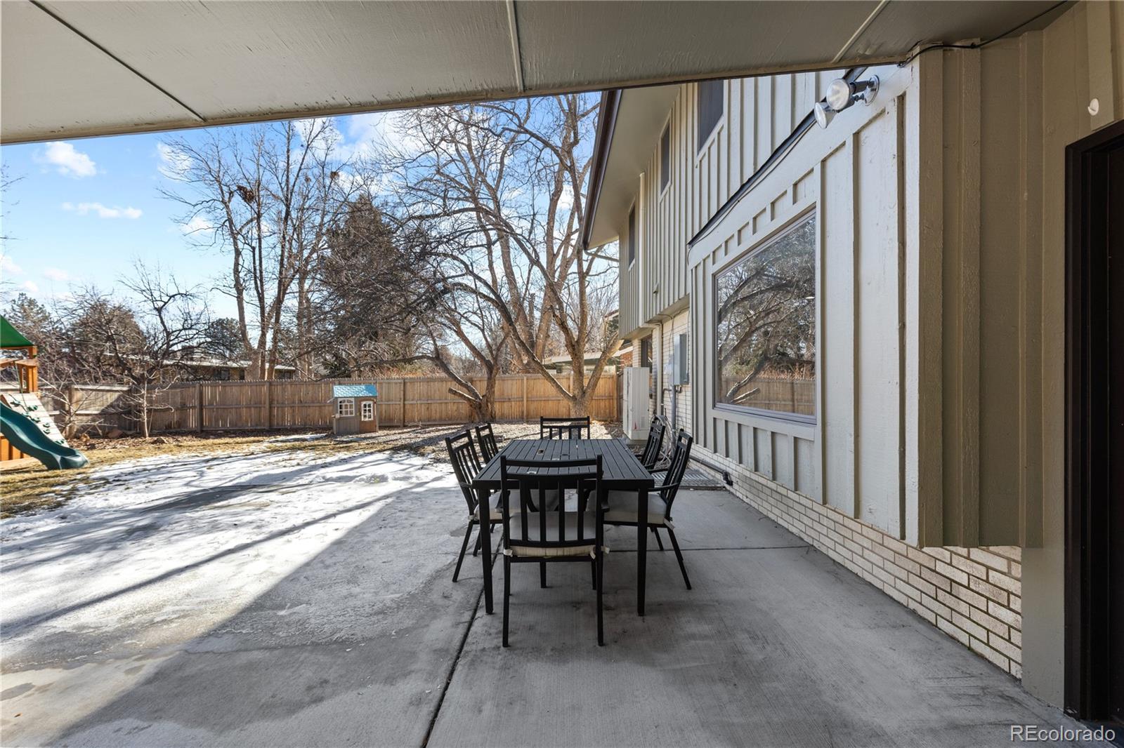 3764 South Niagara Way Denver, CO 80237 - Photo 50 of 50 a view of a patio with a table and chairs and couches