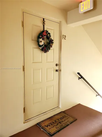 a view of a bathroom with a sink and a mirror