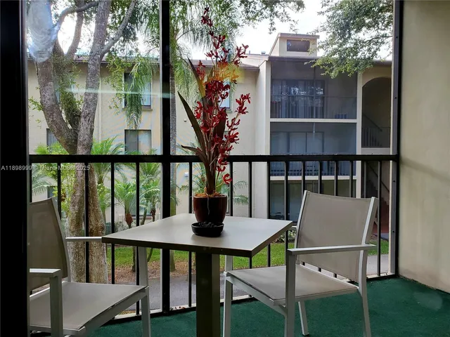 a view of a balcony with chairs