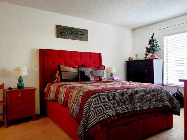 a bedroom with bed and window