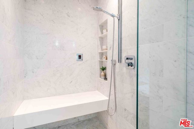 a bathroom with a bathtub and shower