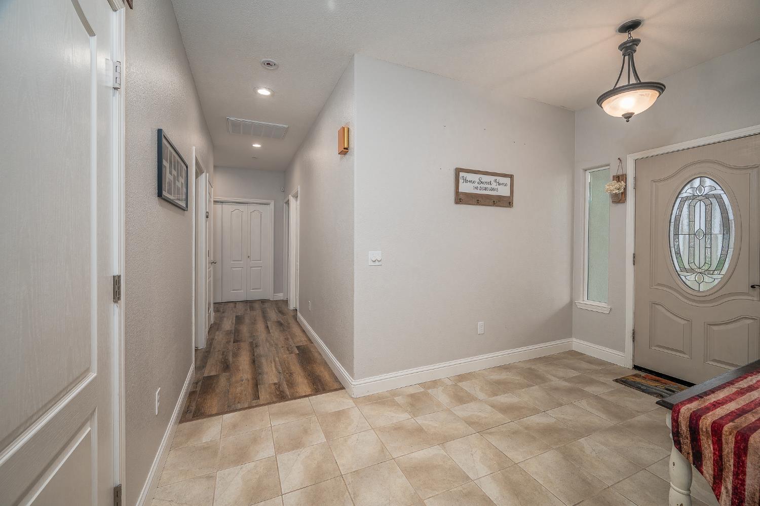 4530 Maximus Road Denair, CA 95316 - Photo 16 of 36 a view of a hallway with wooden floor