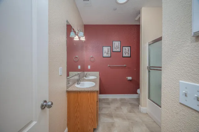 a bathroom with a sink and mirror