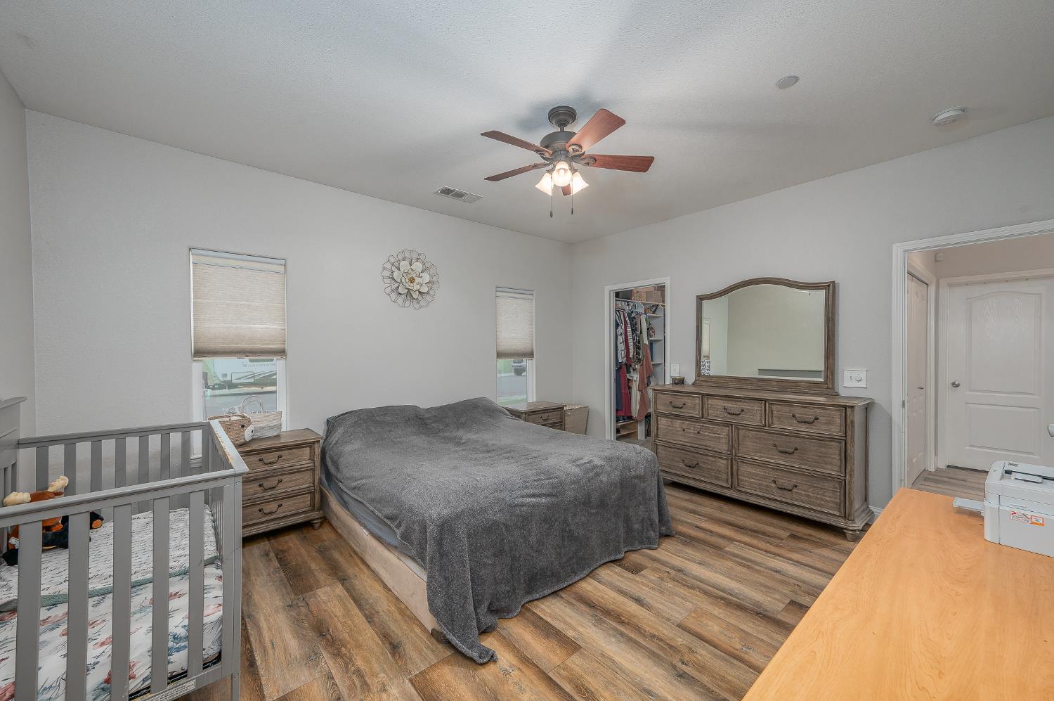 4530 Maximus Road Denair, CA 95316 - Photo 26 of 36 a bedroom with a bed and wooden floor