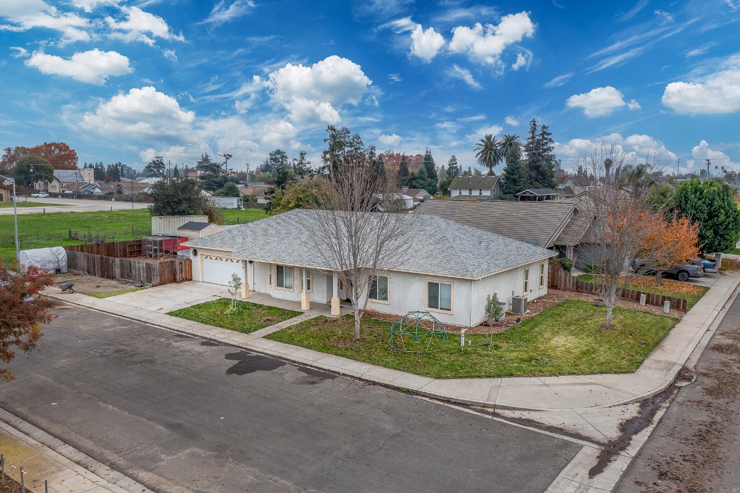 4530 Maximus Road Denair, CA 95316 - Photo 3 of 36 a aerial view of a house with a yard potted plants and large tree