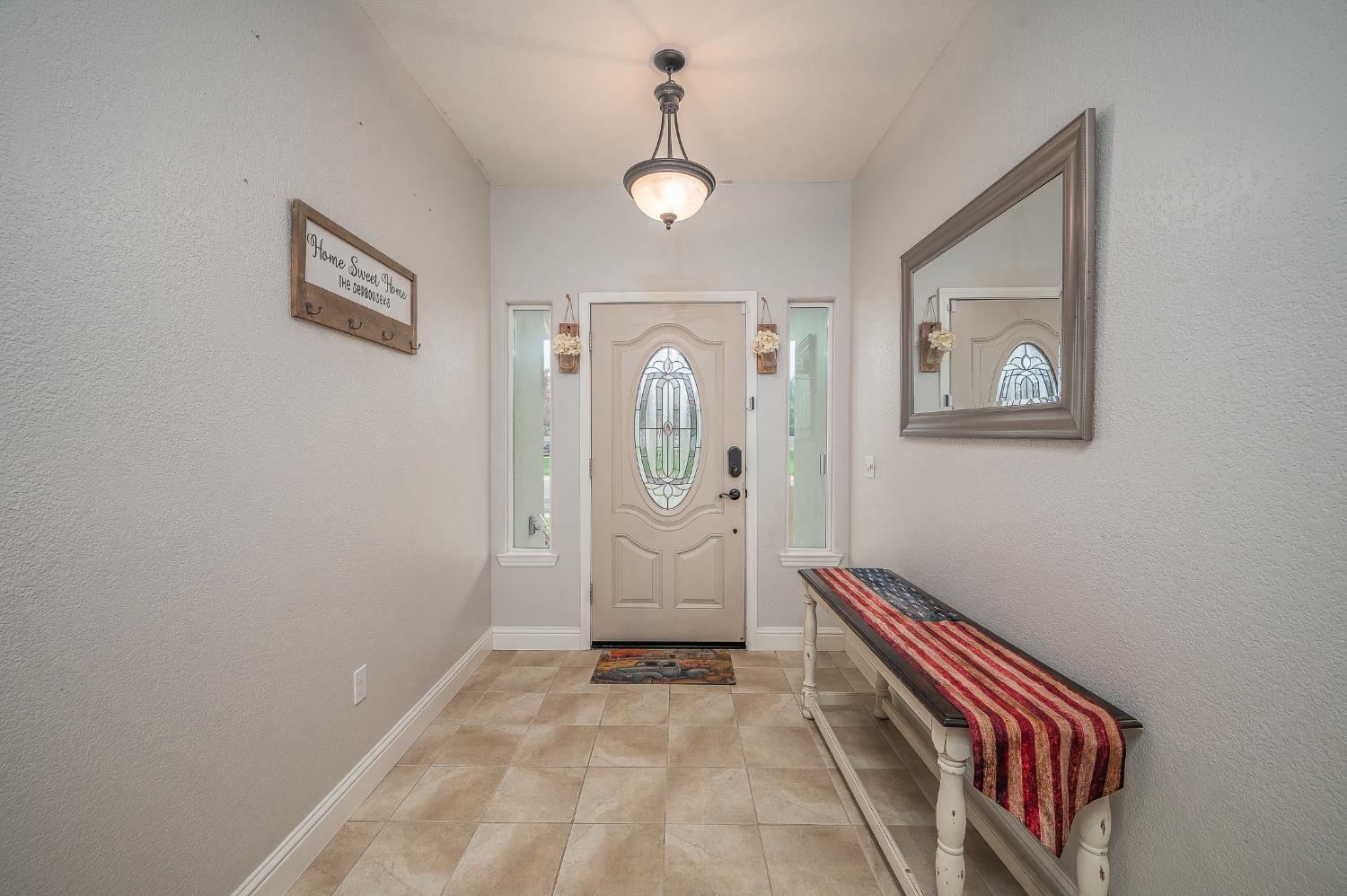 4530 Maximus Road Denair, CA 95316 - Photo 5 of 36 a view of an entryway with wooden floor