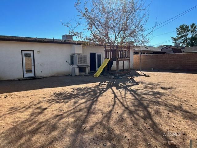 305 South Silver Ridge Street Ridgecrest, CA 93555 - Photo 28 of 32 a view of a backyard with a tree