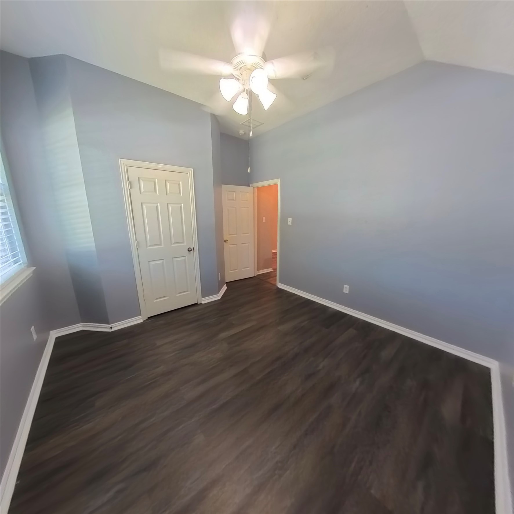 30938 Blue Ridge Park Lane Spring, TX 77386 - Photo 8 of 32 wooden floor in an empty room with a window