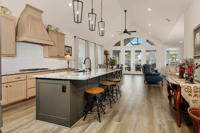 a open kitchen with stainless steel appliances granite countertop a stove and cabinets
