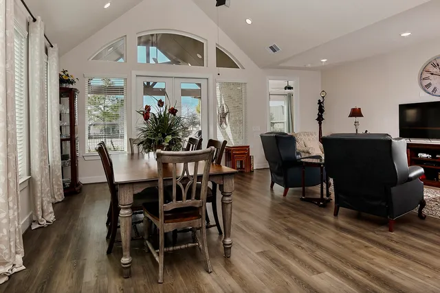 a view of a dining room with furniture window and wooden floor