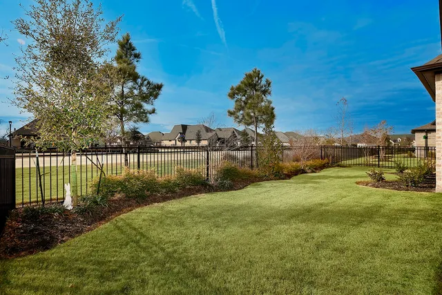 a view of a yard with a lake view