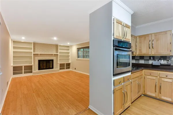 a view of a kitchen with furniture and a fireplace