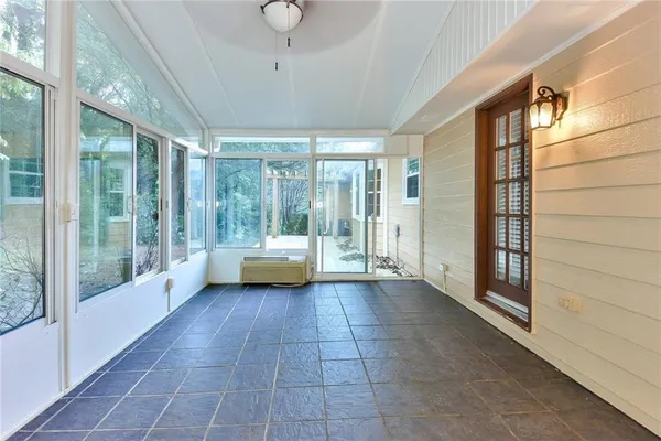 a view of a large room with a balcony