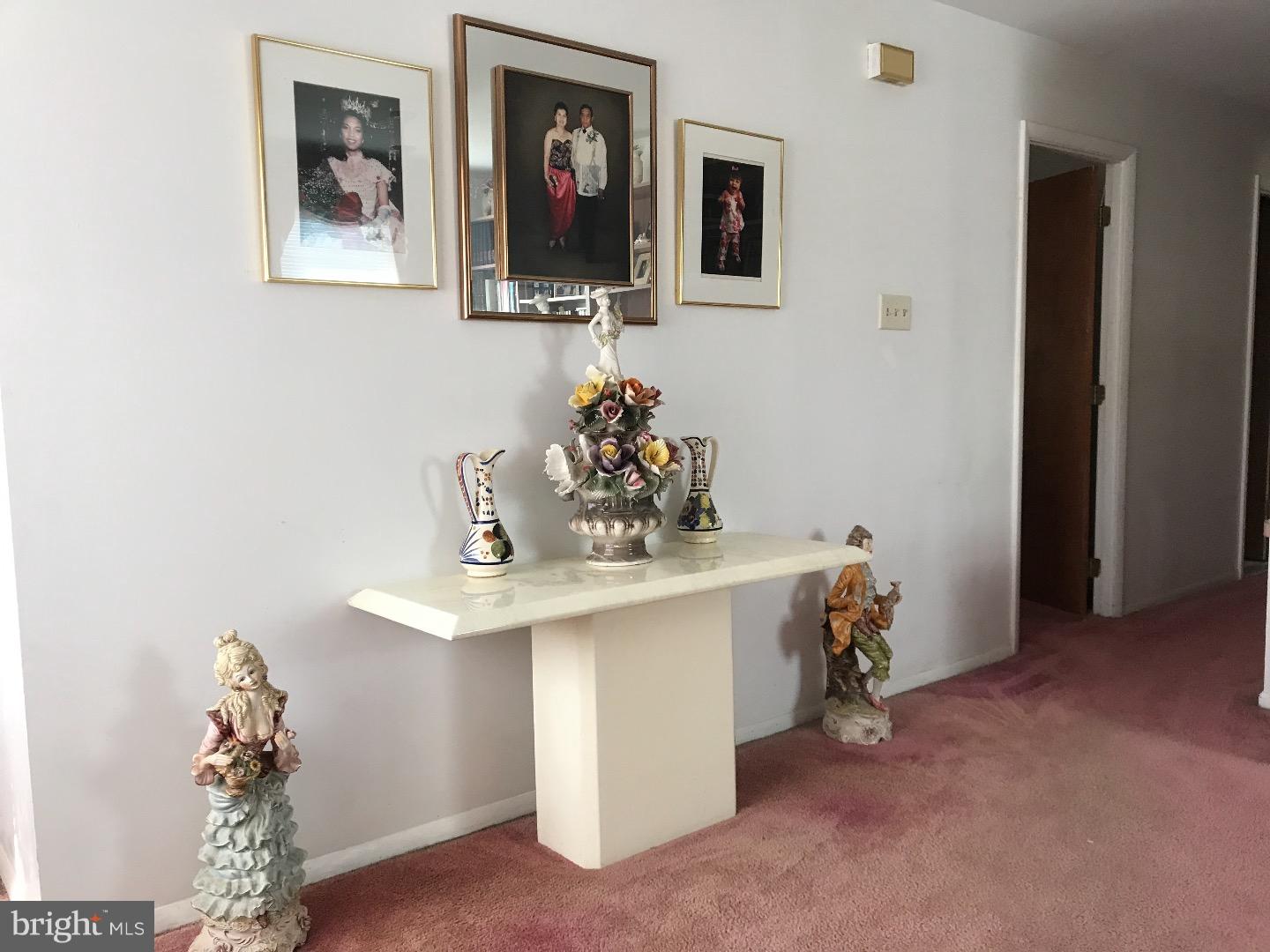 15213 Wayside Road Philadelphia, PA 19116 - Photo 11 of 25 a view of a hallway with paintings on the wall