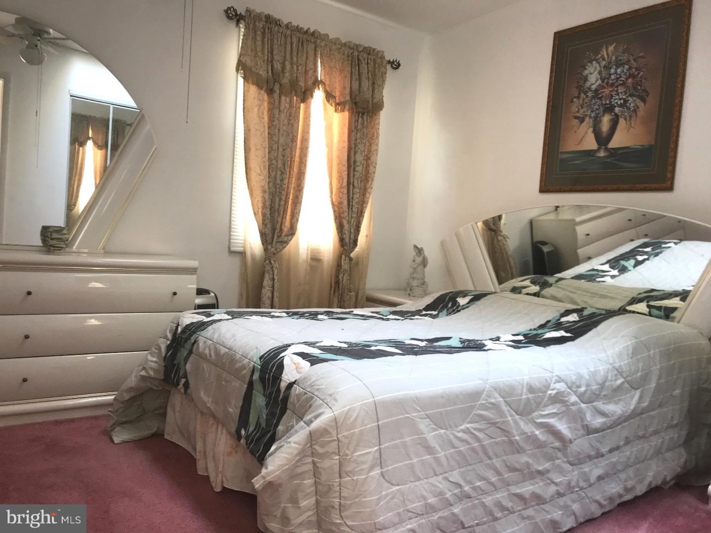 15213 Wayside Road Philadelphia, PA 19116 - Photo 15 of 25 a bedroom with a bed and a window
