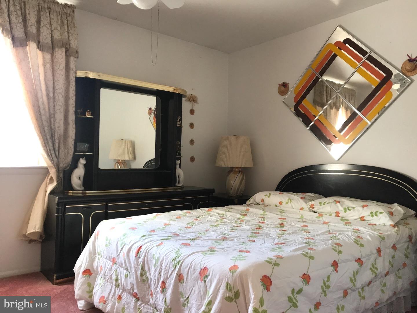 15213 Wayside Road Philadelphia, PA 19116 - Photo 17 of 25 a bedroom with a bed and a painting on the wall