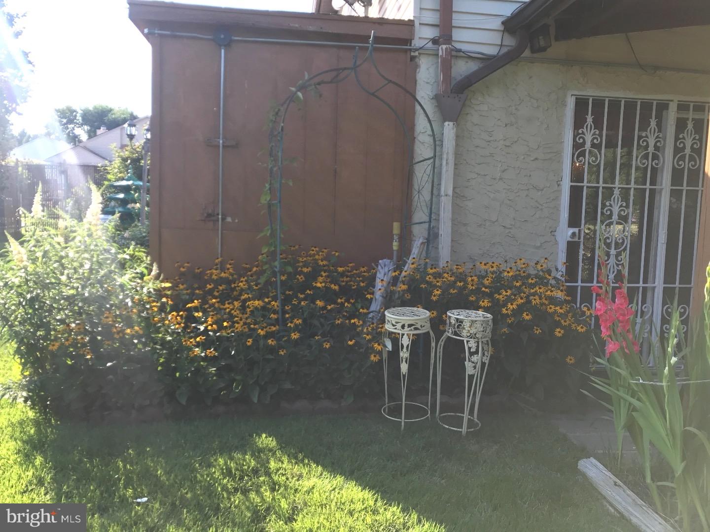 15213 Wayside Road Philadelphia, PA 19116 - Photo 23 of 25 a view of a patio with table and chairs and potted plants