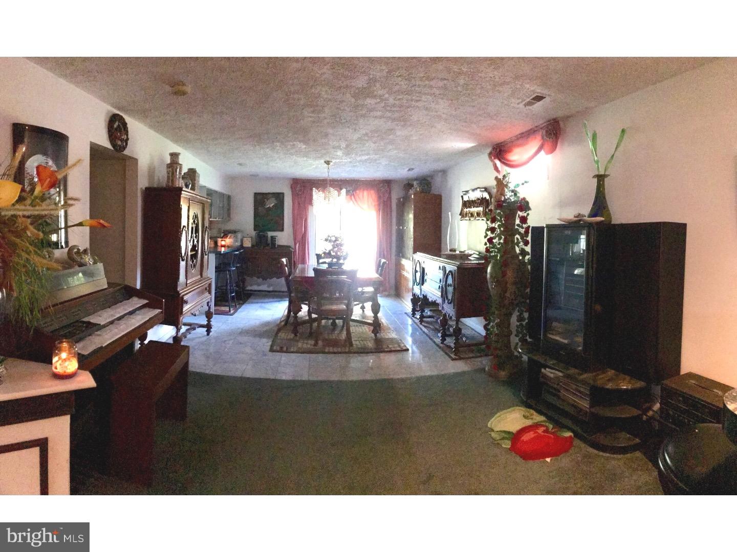15213 Wayside Road Philadelphia, PA 19116 - Photo 5 of 25 a living room with fireplace furniture and a flat screen tv