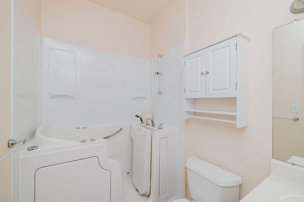 32 Village Way, Unit 32 Westport, MA 02790 - Photo 12 of 15 a bathroom with a toilet and a shower