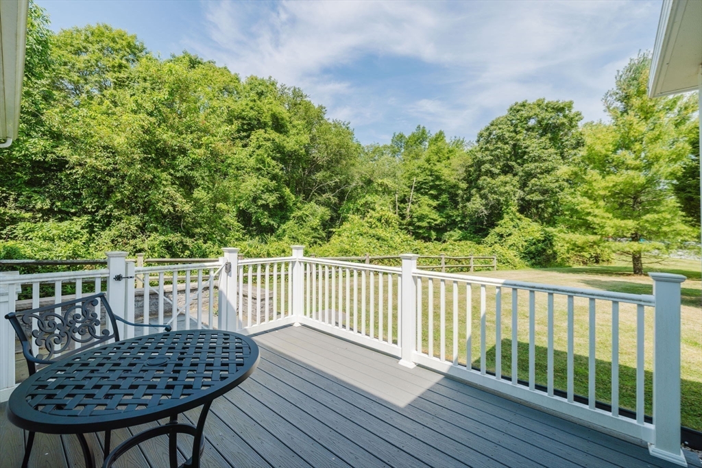 32 Village Way, Unit 32 Westport, MA 02790 - Photo 8 of 15 a view of balcony with wooden floor and outdoor seating
