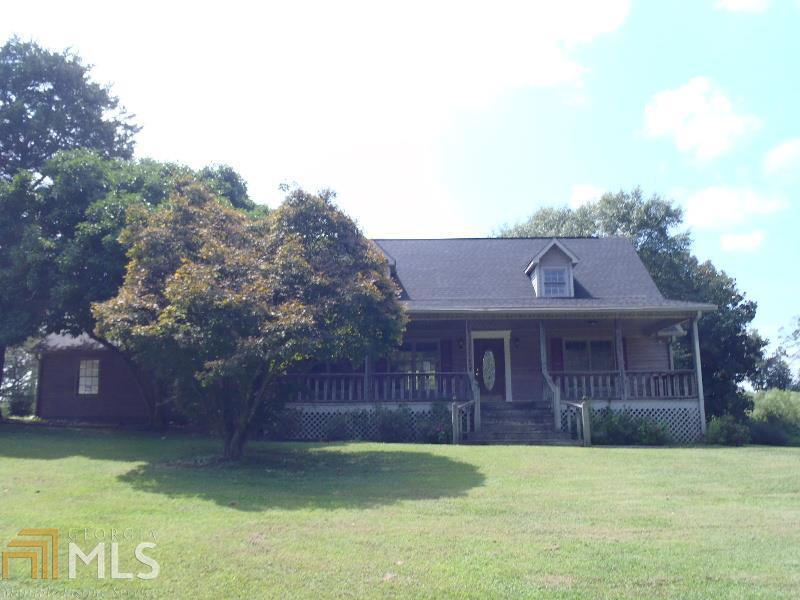 251 Pea Ridge Road Rockmart, GA 30153 - Photo 1 of 1 a front view of a house with a garden and yard
