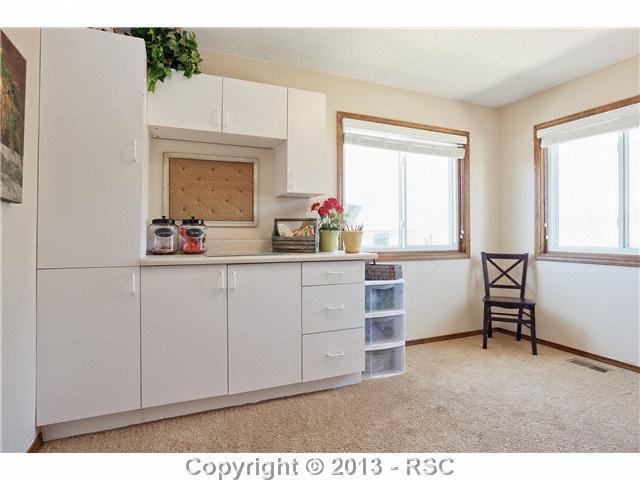 14575 Raton Road Colorado Springs, CO 80921 - Photo 15 of 25 Main level bedroom has builtins and can be a craft room or office.