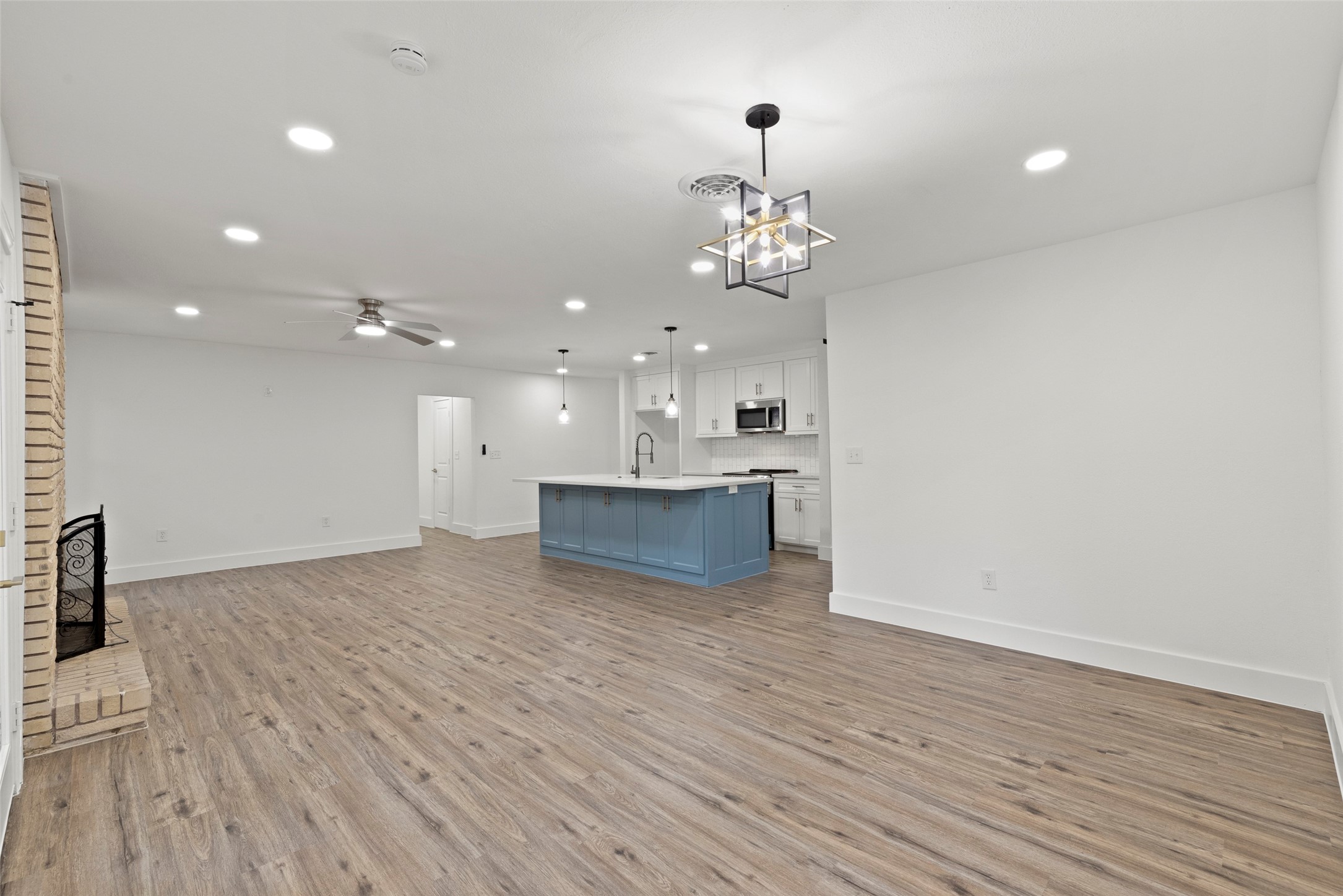 126 Daisy Street Lake Jackson, TX 77566 - Photo 13 of 36 a view of a room with wooden floor and kitchen