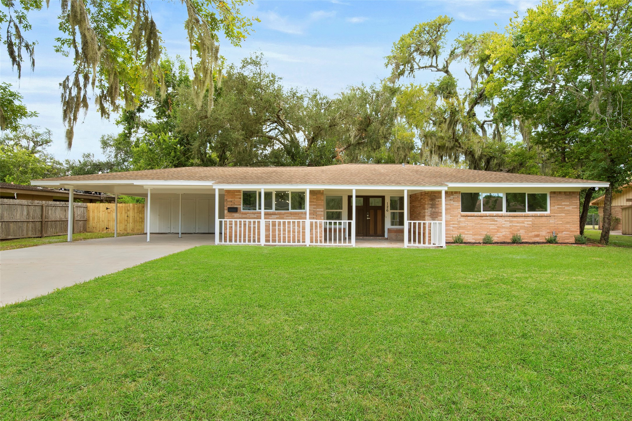 126 Daisy Street Lake Jackson, TX 77566 - Photo 2 of 36 front view of a house with a garden