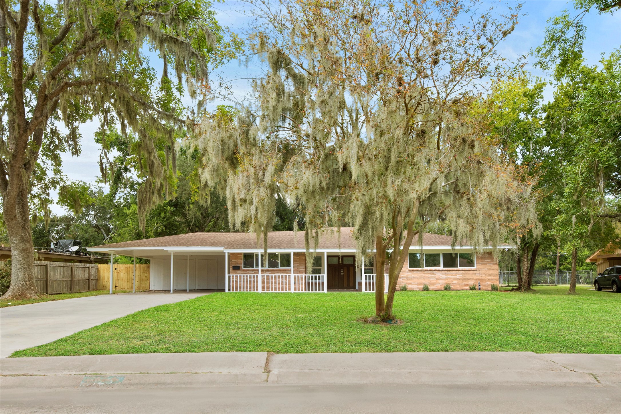 126 Daisy Street Lake Jackson, TX 77566 - Photo 30 of 36 a front view of a house with a garden